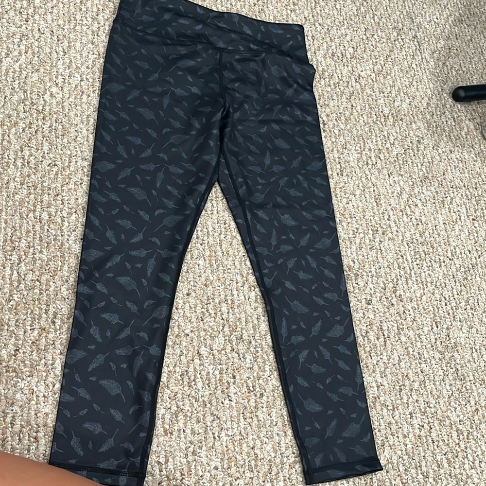 Black leggings with shiny details. Never worn